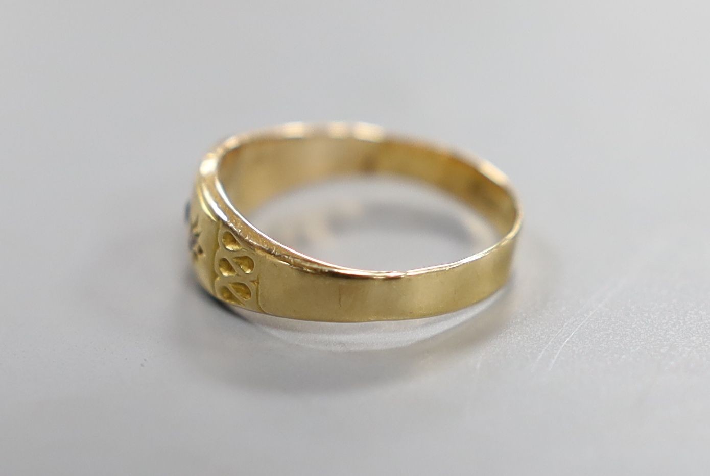 A late Victorian 18ct and three stone gem set ring, size L, gross weight 1.4 grams.